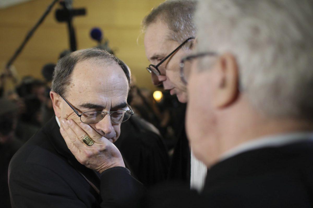 Cardinal Philippe Barbarin listens to his lawyers, Jean-Felix Luciani, 2nd right, and Andre Soulier, back to camera, as he attends the start of his trial, in Lyon, central France on Jan. 7, 2019. (Laurent Cipriani/AP Photo, File)