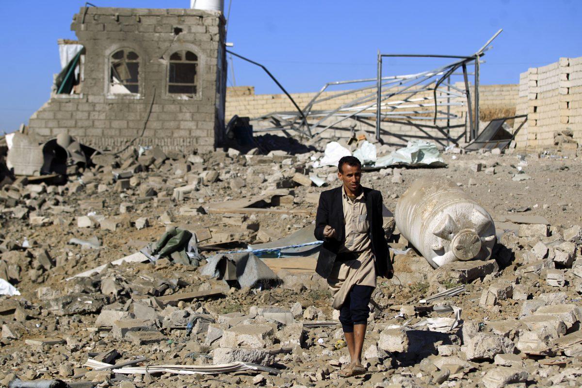A Yemeni man walks in the ruins of a building destroyed in Saudi-led air strikes in Yemen's capital Sanaa, on Feb. 1, 2019. (Mohammed Huwais/AFP/Getty Images)