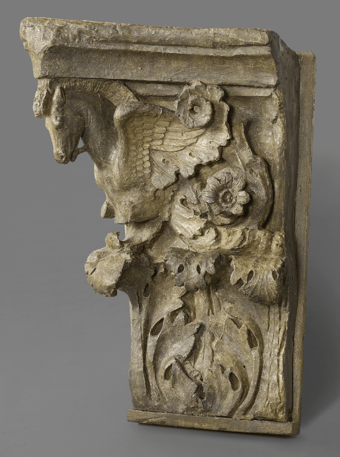 A cast of a Corinthian pilaster capital with Pegasus volutes (spiral scrolls) from the Forum of Augustus in Rome, late 18th century or early 19th century. Plaster cast. Height: 36 inches, Width: 25 inches. The original is in the Museum at Trajan’s Markets, Rome. (Royal Academy of Arts, London)