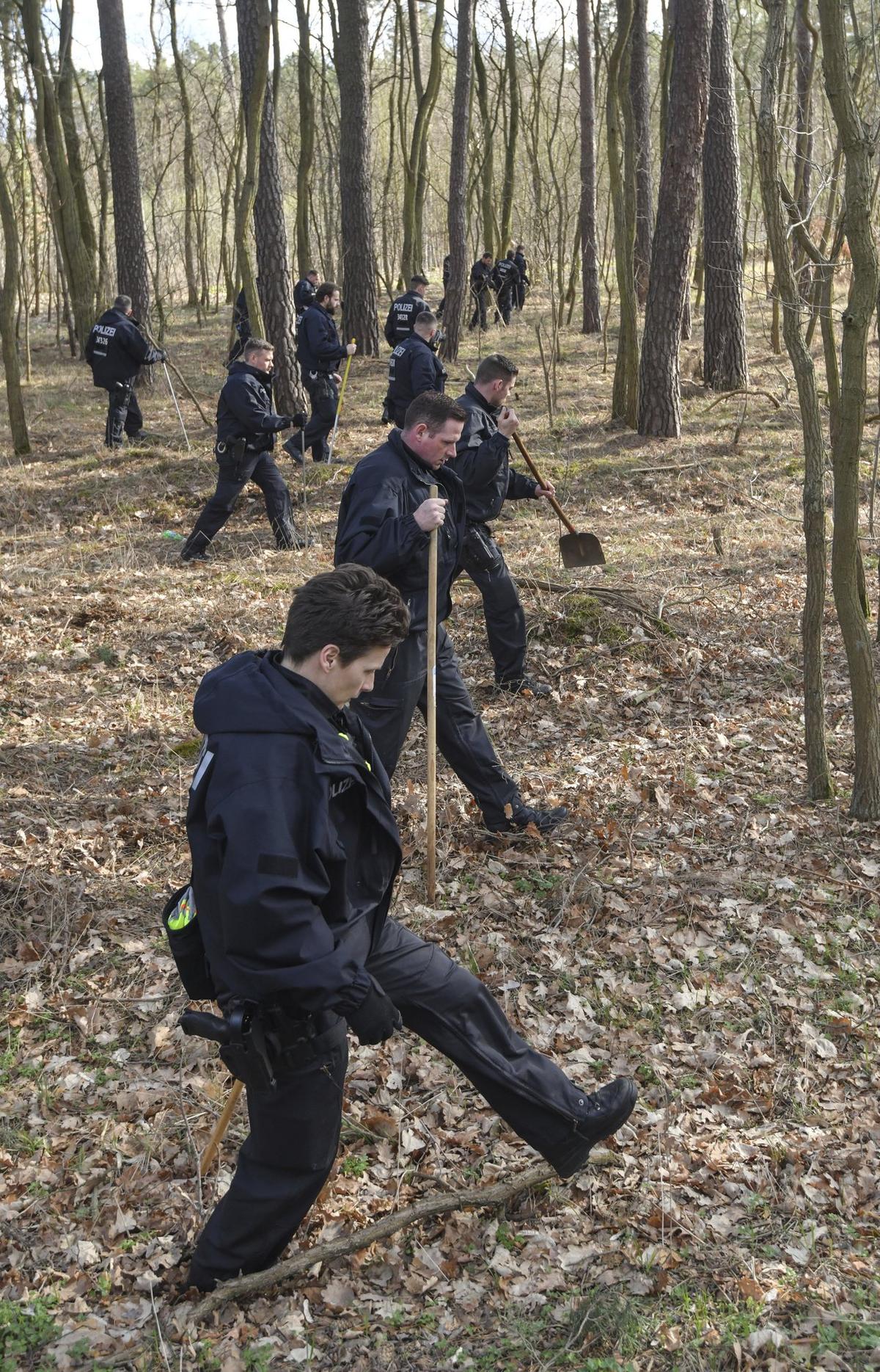 Berlin police search a forest in Kummersdorf, Germany. Hundreds of police officers are searching for a girl who went missing in Berlin last month, in a case that has distressed the country. German news agency dpa reported that 100 officers were sifting through a forest 18 miles southeast of the capital on March 8, 2019. (Patrick Pleul/dpa via AP)