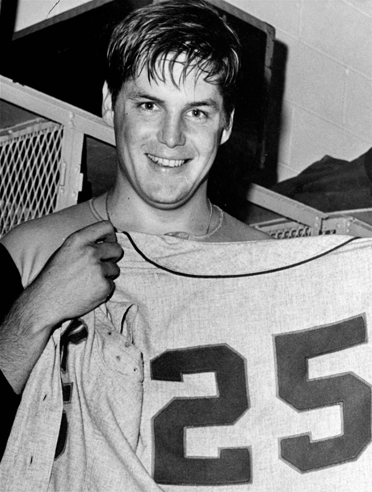 New York Mets pitcher, Tom Seaver holds up a No. 25 Mets' uniform after winning his 25th victory of the year against the Philadelphia Phillies in Philadelphia on Sept. 27, 1969. (AP Photo, File)
