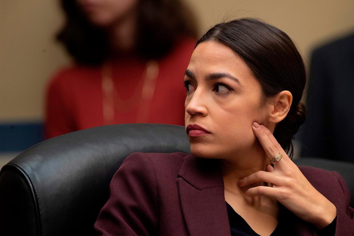 Congresswoman Alexandria Ocasio-Cortez (D-NY) listens as Michael Cohen, attorney for President Trump, testifies before the House Oversight and Reform Committee in the Rayburn House Office Building on Capitol Hill in Washington on Feb. 27, 2019. (Jim Watson/AFP/Getty Images)