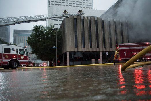 Firefighters put out a fire during the aftermath of Hurricane Harvey in Houston on Aug. 28, 2017. (Brendan Smialowski/AFP/Getty Images)