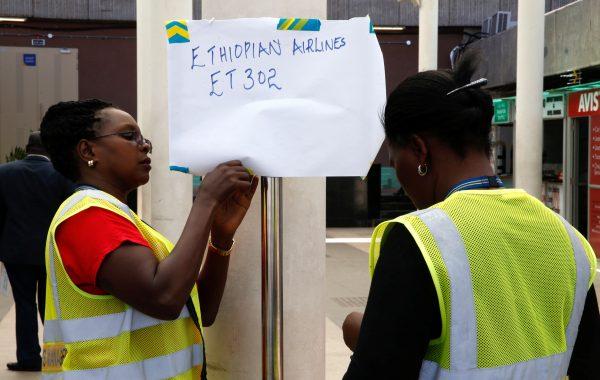 Kenya Airports Authority (KAA) workers hang an information notice of Ethiopian Airlines Flight ET 302, at the Jomo Kenyatta International Airport (JKIA) in Nairobi, Kenya, on March 10, 2019. (Reuters/Baz Ratner)