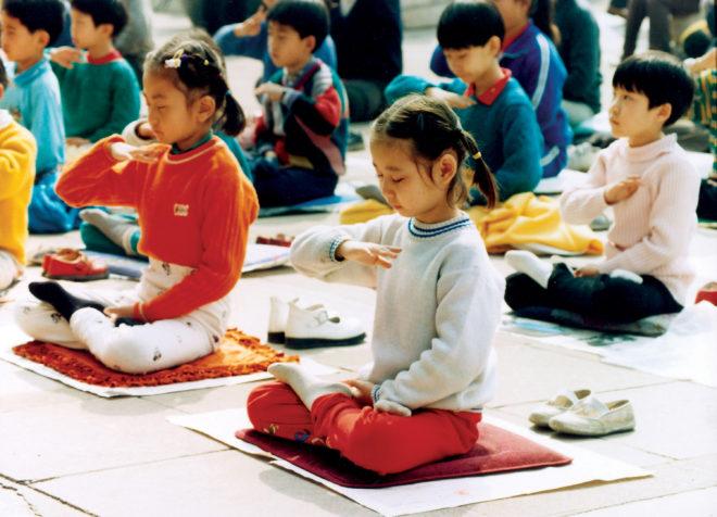 In this undated photo, children practice Falun Gong meditation in China before the Chinese Communist Party began its persecution of the spiritual practice in July 1999. (Courtesy of Minghui.org)