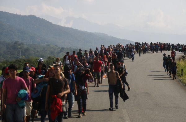 Central American caravan migrants walk along a roadside in Huixtla, Mexico, on their way to the United States on Jan. 20, 2019. (Mario Tama/Getty Images)