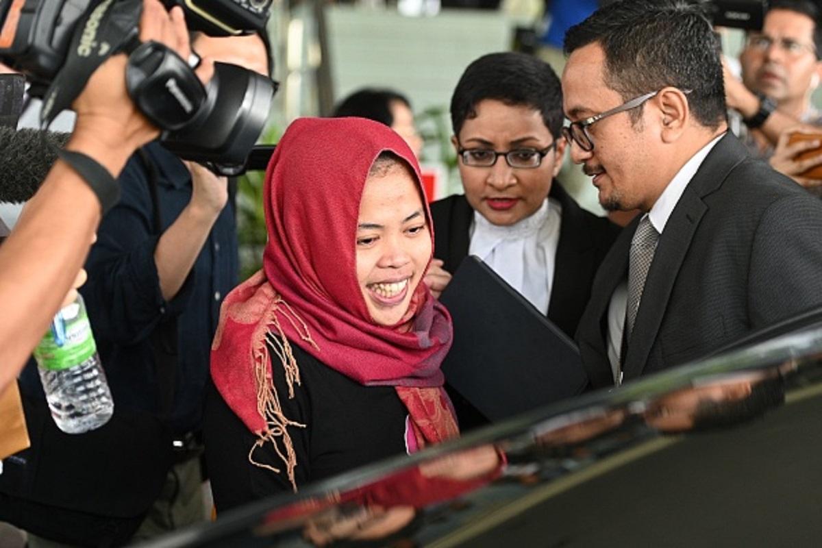 Indonesian national Siti Aisyah (C) smiles while leaving the Shah Alam High Court, outside Kuala Lumpur on March 11, 2019 after her trial for her alleged role in the assassination of Kim Jong Nam, the half-brother of North Korean leader Kim Jong Un. (Mohd Rasfan/AFP/Getty Images)