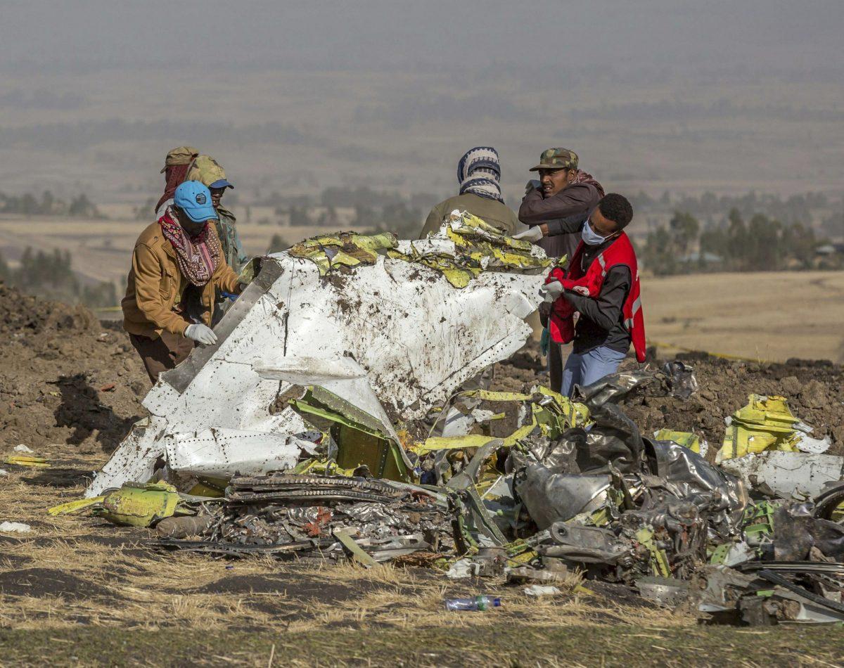 Rescuers work at the scene of an Ethiopian Airlines flight crash near Bishoftu, or Debre Zeit, south of Addis Ababa, Ethiopia, March 11, 2019. (Mulugeta Ayene/AP Photo)