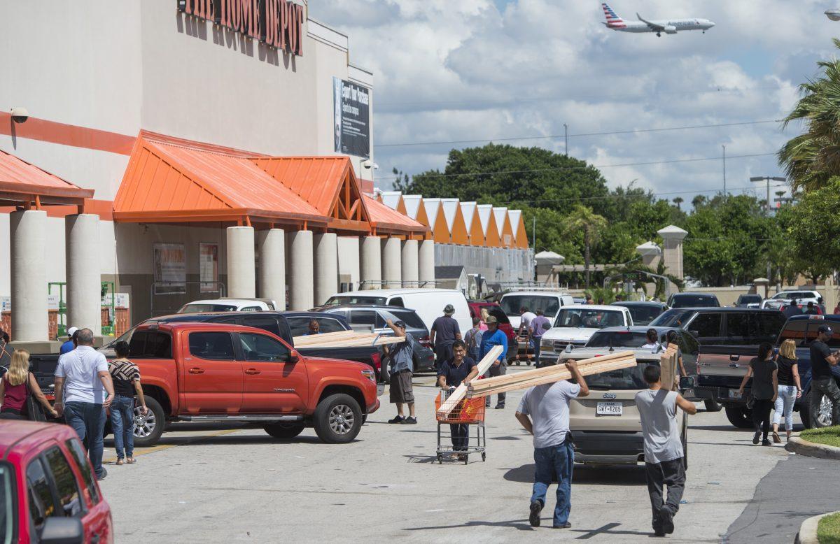  People leave with supplies outside a Home Depot store in Miami, Fla,, as they prepare for Hurricane Irma, Sept. 7, 2017. (Saul Loeb/AFP via Getty Images)