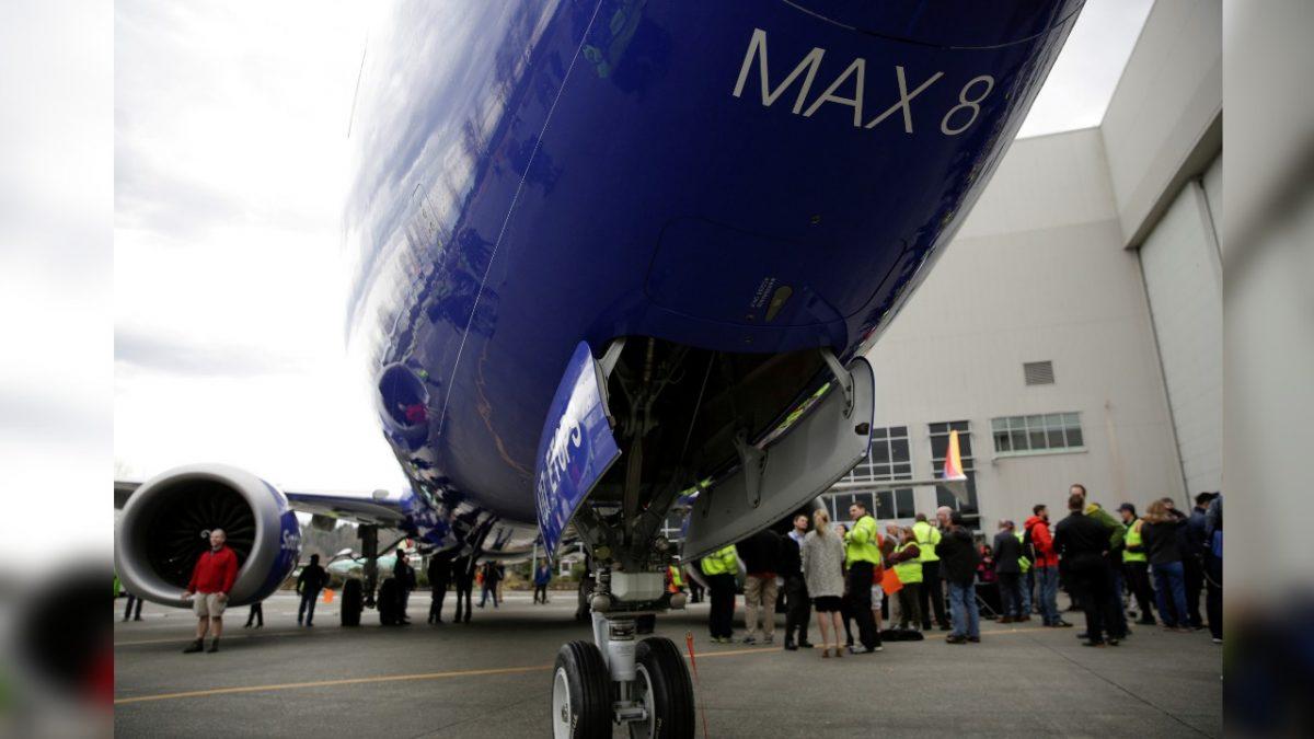 Boeing employees are pictured in front of a 737 MAX 8 produced for Southwest Airlines as Boeing celebrates the 10,000th 737 to come off the production line in Renton, Washington, on March 13, 2018. (Jason Redmond/Reuters)