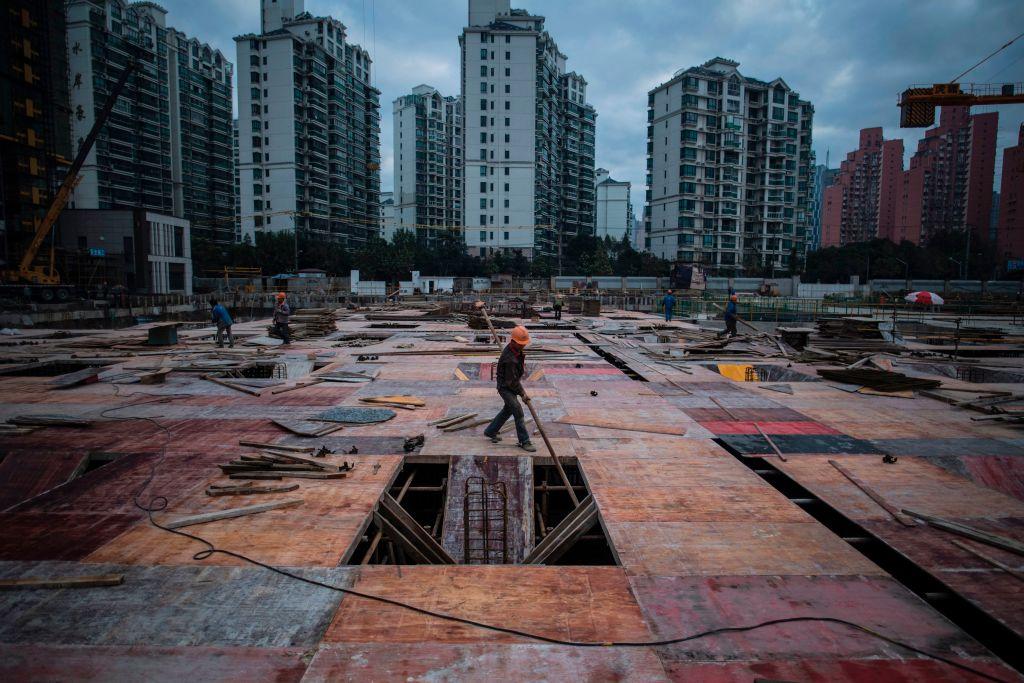 A man works at a construction site of a residential skyscraper in Shanghai, China, in this file photo. (Johannes Eisele/AFP/Getty Images)