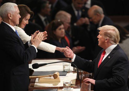 President Donald Trump shakes hands with Speaker Nancy Pelosi (D-Calif.), as Vice President Mike Pence looks on, after the State of the Union address in the chamber of the House of Representatives at the U.S. Capitol Building in Washington on Feb. 5, 2019. (Win McNamee/Getty Images)
