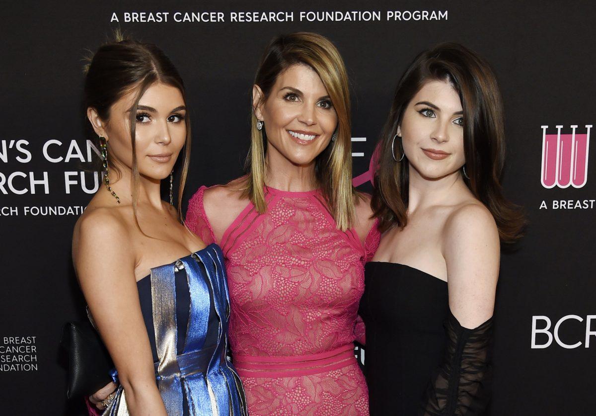 Actress Lori Loughlin (C) poses with daughters Olivia Jade Giannulli (L) and Isabella Rose Giannulli at the 2019 "An Unforgettable Evening" in Beverly Hills, Calif., on Feb. 28, 2019. (Chris Pizzello/Invision/AP)