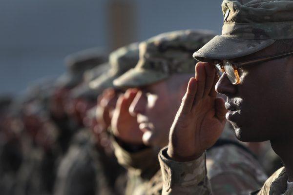 U.S. Army soldiers salute during the national anthem during the anniversary ceremony of the terrorist attacks on Sept. 11, 2001, at Bagram Air Field, Afghanistan on Sept. 11, 2011. (John Moore/Getty Images)