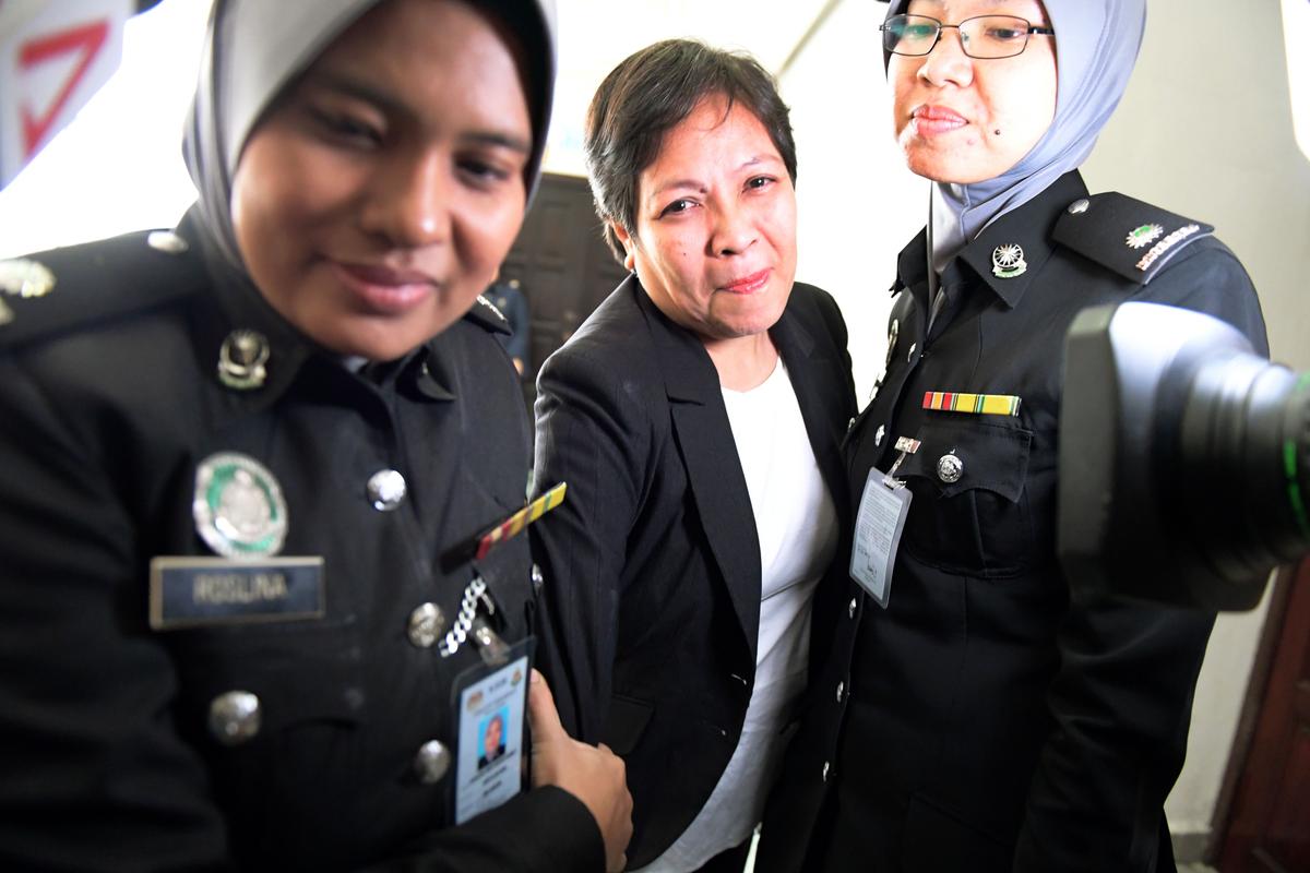 Maria Elvira Pinto Exposto (C) reacts after she was cleared of drug trafficking charges at Shah Alam High Court in Shah Alam, outside Kuala Lumpur, on Dec. 27, 2017.<br/>(Mohd Rasfan/AFP/Getty Images)