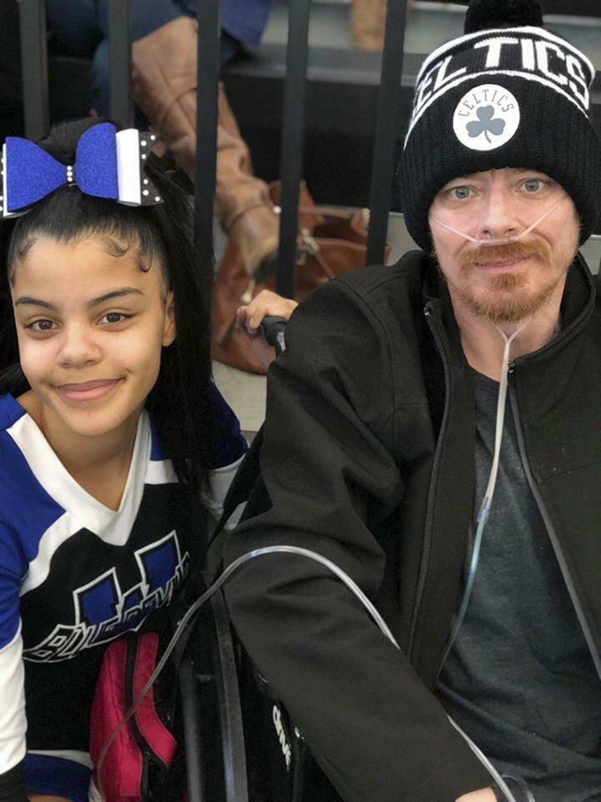 In this photo provided by Bridgette Hoskie, her daughter Tianna Greene and brother Jay Barrett pose for a photo at a cheerleading competition in New Haven, Conn., on March 3, 2019. (Bridgette Hoskie via AP, File)