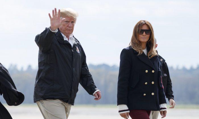 President Donald Trump and first lady Melania Trump walk from Marine One to board Air Force One at Lawson Army Airfield, Fort Benning, Ga., en route Palm Beach International Airport in West Palm Beach, Fla., after visiting Lee County, Ala., where tornados killed 23 people, on March 8, 2019. (Carolyn Kaster/AP Photo)