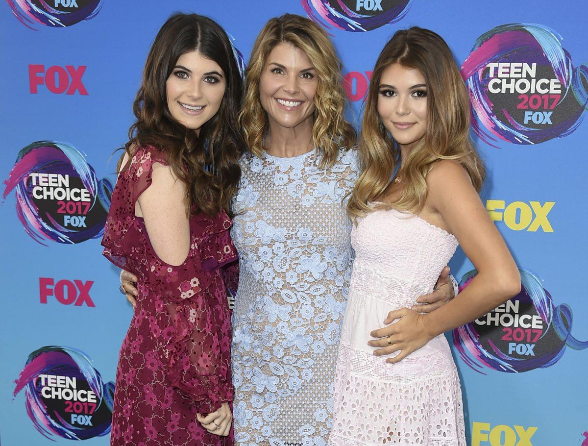 Actress Lori Loughlin (C) poses with her daughters Bella (L) and Olivia Jade at the Teen Choice Awards in Los Angeles in a file photo. (Jordan Strauss/Invision/AP, File)