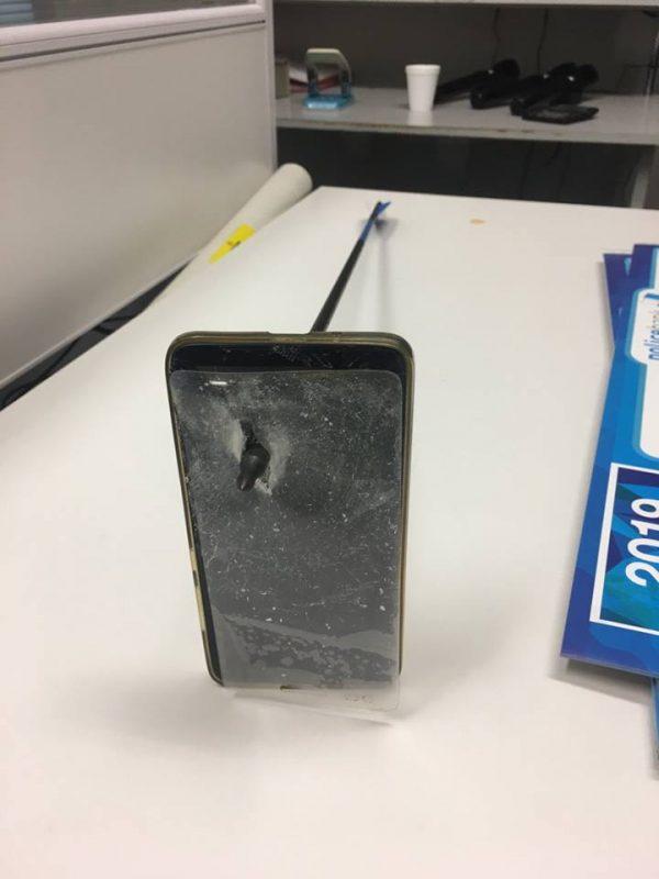 A mobile phone with an arrow embedded in it in the town of Nambin, New South Wales, Australia. (New South Wales Police)