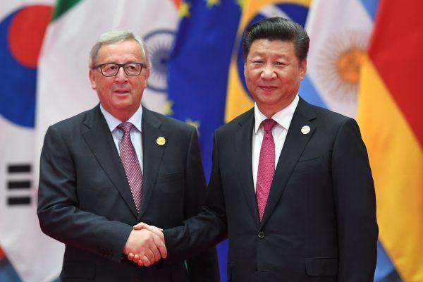 President of the European Commission Jean-Claude Juncker is greeted by Chinese leader Xi Jinping in Hangzhou, China, on Sept. 4, 2016. (Greg Baker/FP/Getty Images)