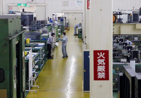 Workers are seen at the factory of Nagumo Seisakusho Co., Ltd. in Jyoetsu, Niigata prefecture, Japan on Feb. 22, 2019. (Tetsushi Kajimoto/Reuters)