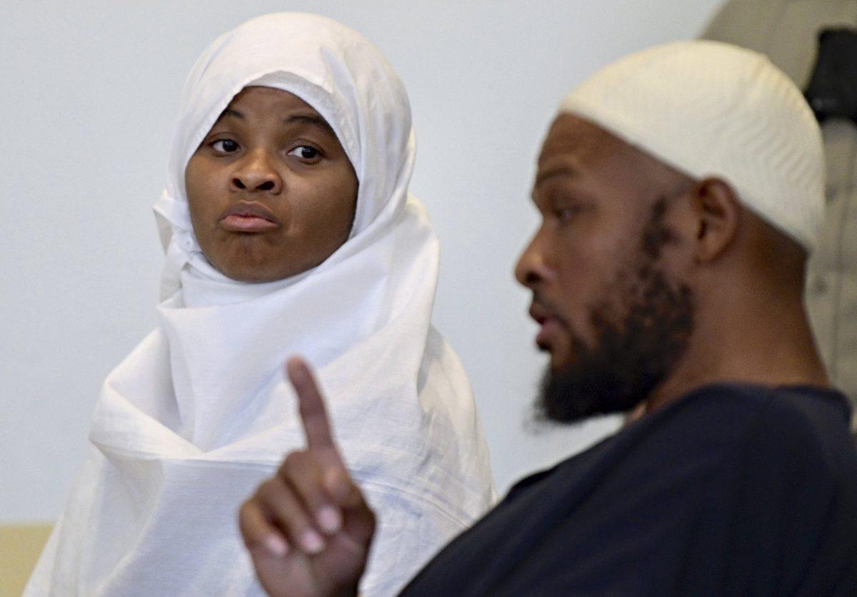 Defendants Hujrah Wahhaj, left, and Siraj Wahhaj talk during a break in court hearings in Taos, N.M., on Aug. 13, 2018. (Roberto E. Rosales/The Albuquerque Journal/File via AP)