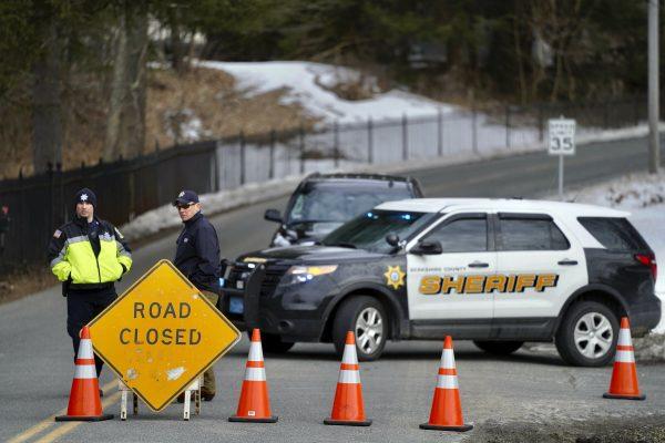 Berkshire County Sheriff Department officers close off the road Wednesday, March 13, 2019. (Ben Garver/The Berkshire Eagle via AP)