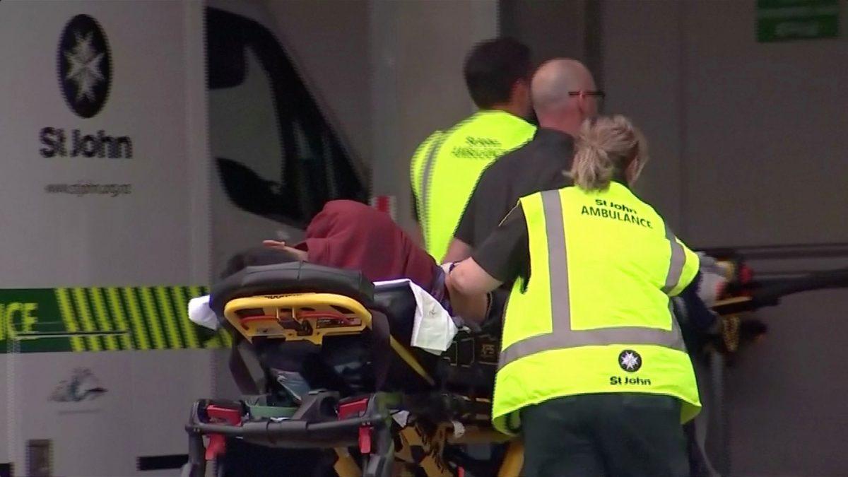 Emergency services personnel push stretchers carrying a person into a hospital, after reports that several shots had been fired, in central Christchurch, New Zealand on March 15, 2019. (TVNZ via Reuters TV)