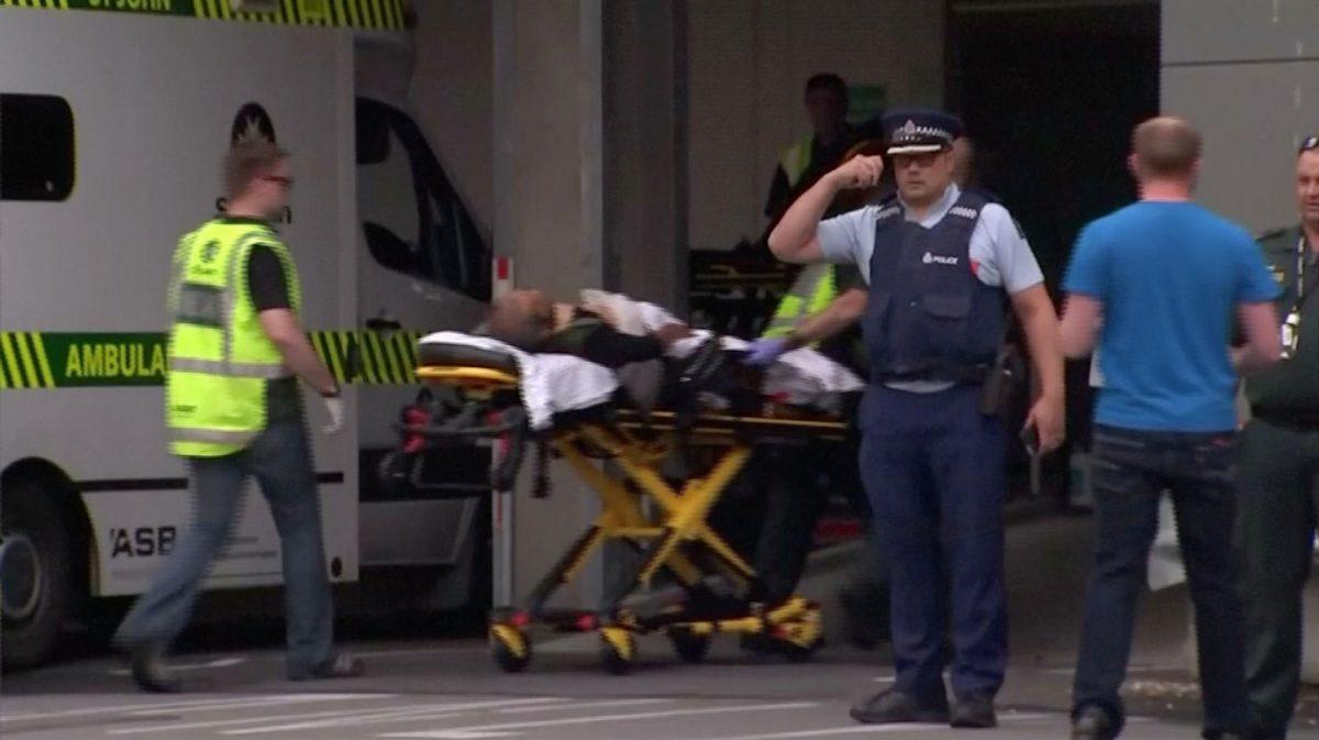 Emergency services personnel transport a stretcher carrying a person at a hospital, after reports that several shots had been fired, in central Christchurch, New Zealand, on March 15, 2019, in this still image taken from video. (TVNZ/via Reuters TV)