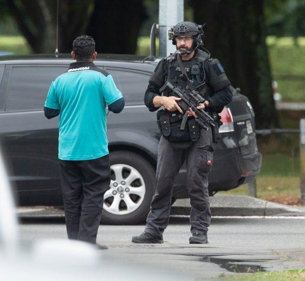 A member of the AOS (Armed Offenders Squad) stands ready following a shooting at the Al Noor mosque in Christchurch, New Zealand, on March 15, 2019. (Reuters/SNPA/Martin Hunter)