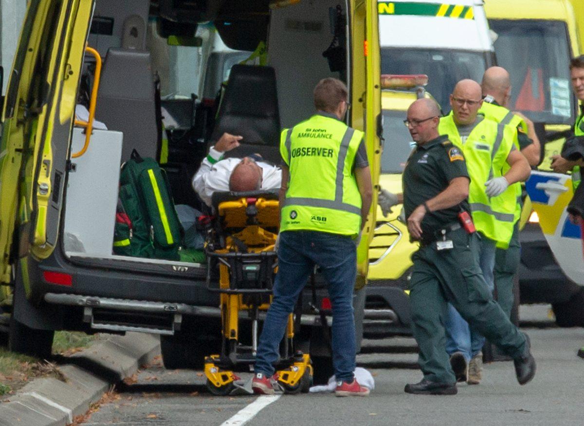 An injured person is loaded into an ambulance following a shooting at the Al Noor mosque in Christchurch, New Zealand, March 15, 2019. (Martin hunter/Reuters/SNPA)