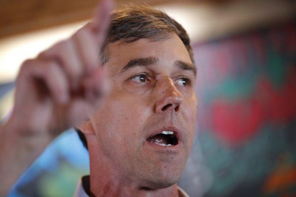 Former Texas congressman Beto O’Rourke speaks to local residents during a stop at the Central Park Coffee Company in Mount Pleasant, Iowa, on March 15, 2019. (Charlie Neibergall/AP)