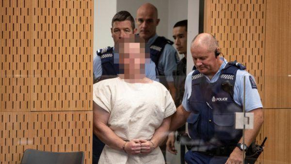 Brenton Tarrant, charged for murder in relation to the mosque attacks, is led into the dock for his appearance in the Christchurch District Court, New Zealand, on March 16, 2019. (Mark Mitchell/New Zealand Herald/Pool via Reuters)