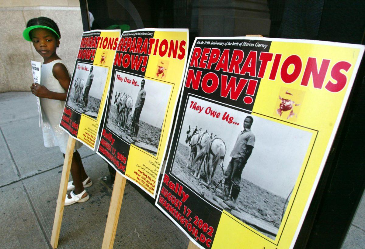A slavery reparations protest outside New York Life Insurance Company offices in New York City on Aug. 9, 2002. (Mario Tama/Getty Images)