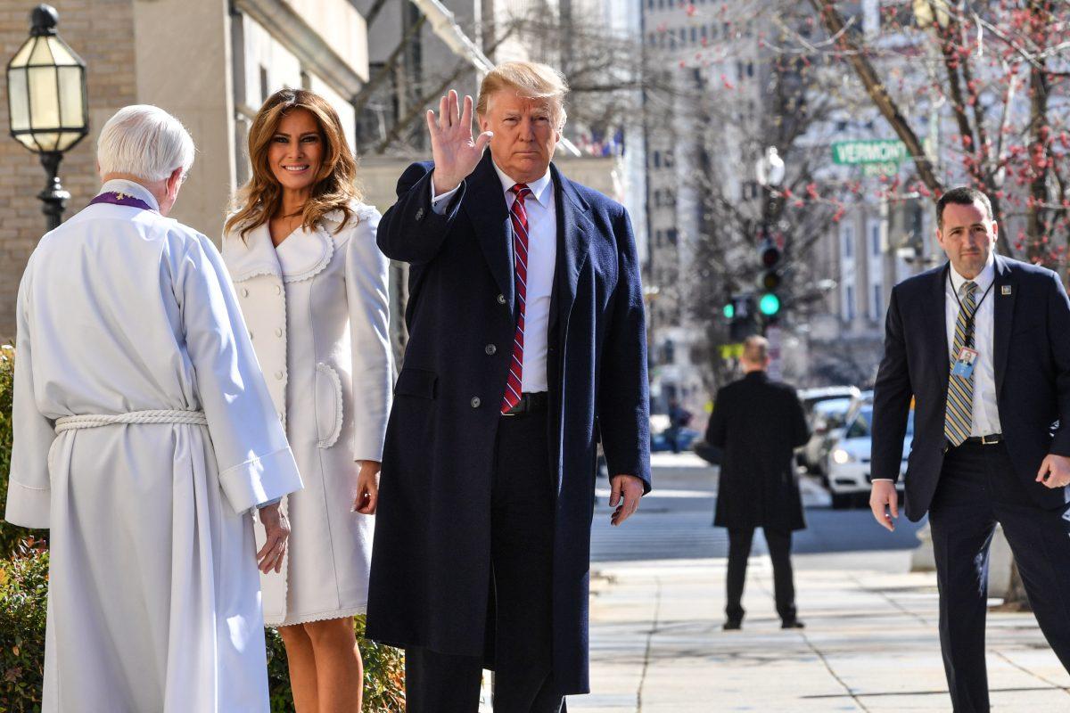President Donald Trump and First Lady Melania Trump (2nd L) are welcome by interim rector Bruce McPherson (L) as they arrive at St. Johns Episcopal church in Washington, on March 17, 2019. (Nicholas Kamm/AFP/Getty Images)