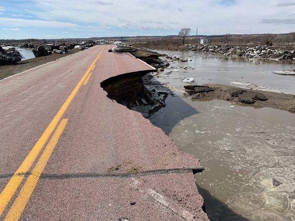 A damaged road is seen after a storm triggered historic flooding in Niobrara, Nebraska, on Mar. 16, 2019. (Office of Governor Pete Ricketts/Reuters)