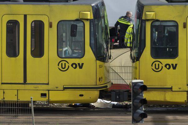 A body is covered with a white sheet after a shooting in a tram in Utrecht, Netherlands, on March 18, 2019. (Peter Dejong/AP Photo)