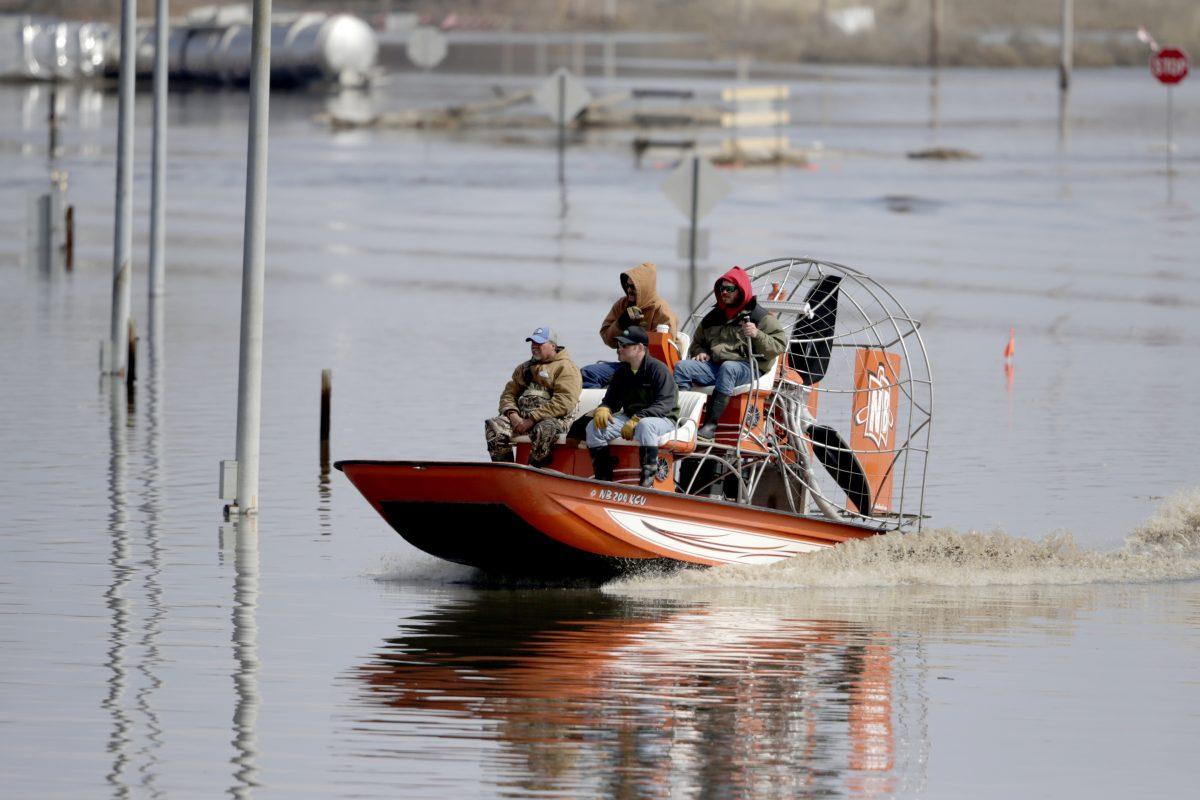 An airboat surveys damage from the flood waters of the Platte River, in Plattsmouth, Neb., on March 17, 2019. (Nati Harnik/AP photo)