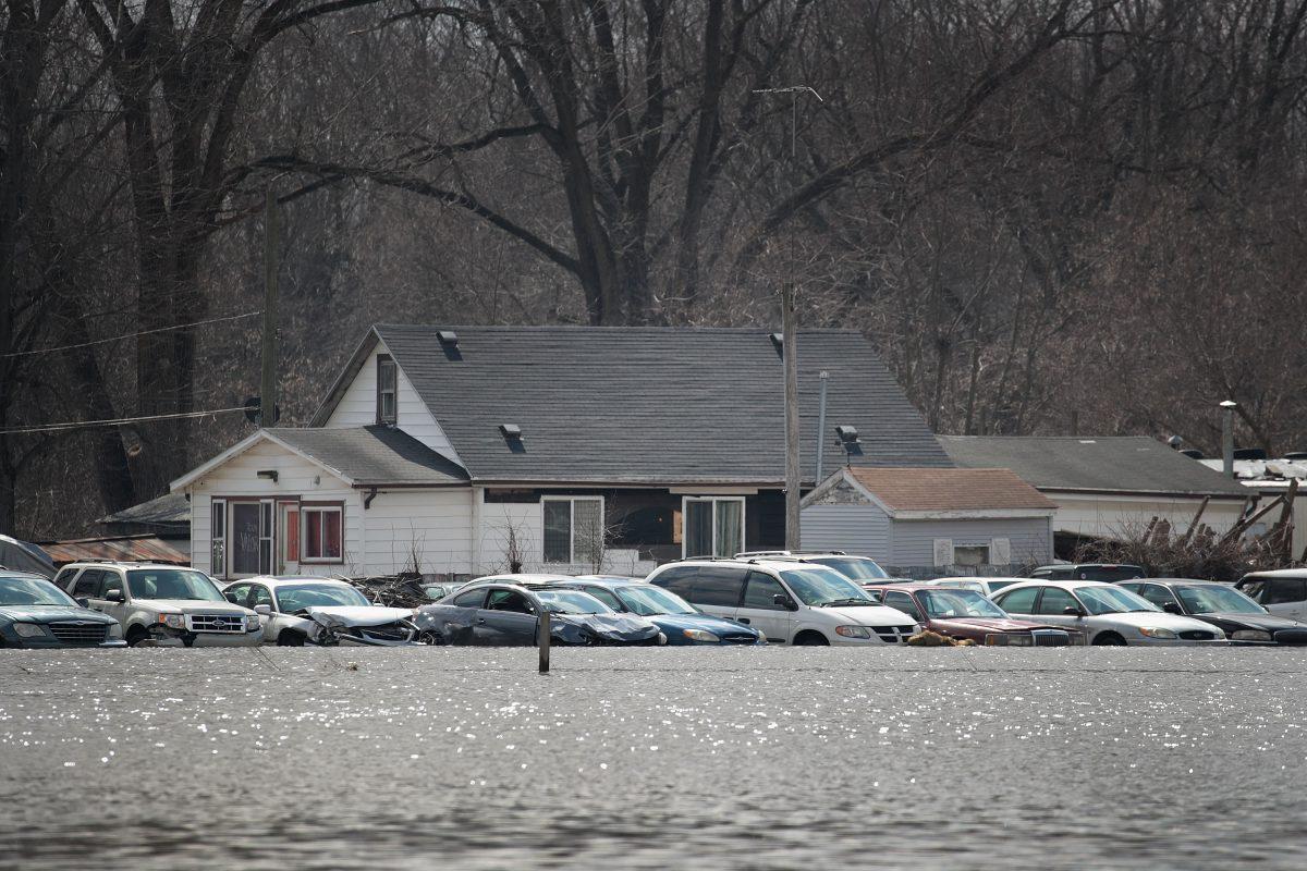 Cars sit in floodwater from the Pecatonica River in Freeport, Illinois, on March 18, 2019. (Scott Oslon/Getty Images)