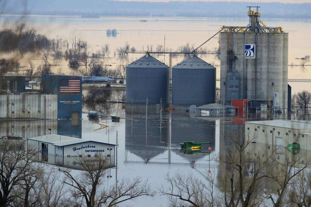 Floodwaters surround buildings on the southwest side of Hamburg, Iowa. on March 17, 2019. (Ryan Soderlin/Omaha World-Herald/AP)