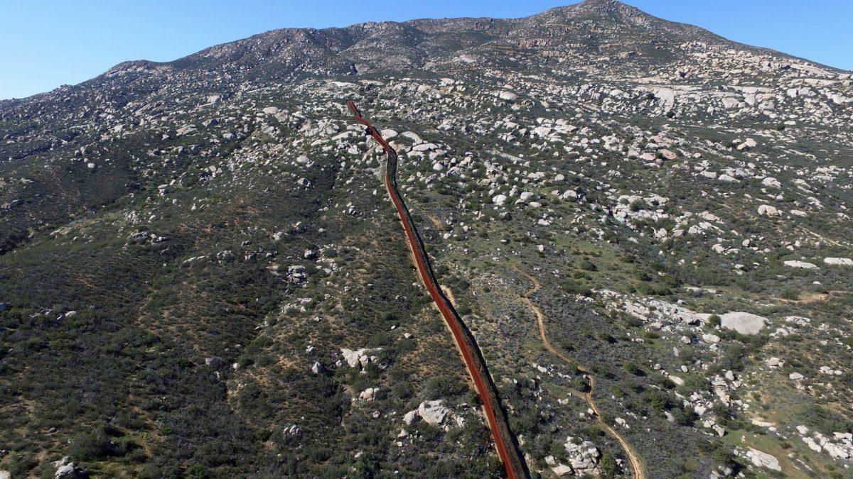 Aerial picture taken with a drone of the urban fencing on the border between the United States and Mexico in Tecate, northwestern Mexico on Jan. 26, 2017. (Mario Vazquez/AFP/Getty Images)