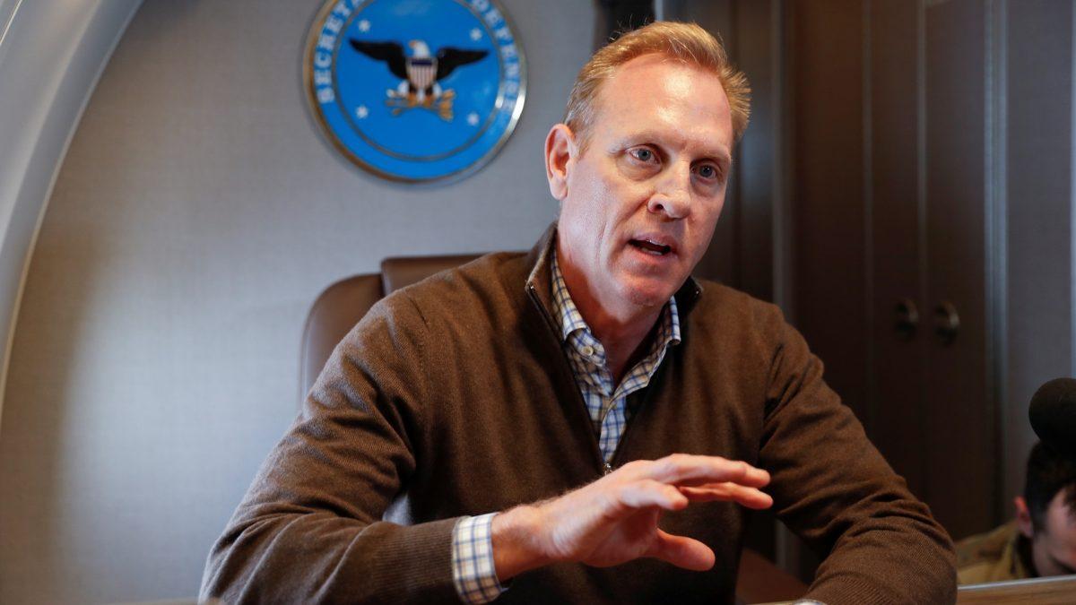 Acting Secretary of Defense Patrick Shanahan gestures while speaking to members of the media aboard a military plane prior to his arrival at Andrews Air Force Base, Md., on Feb. 23, 2019. (Pablo Martinez Monsivais/Pool via Reuters)
