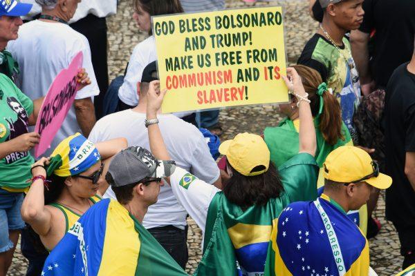 Supporters of Brazilian President-elect Jair Bolsonaro, gather at the "Tres Poderes" square in front of the Planalto Palace in Brasilia, before his inauguration ceremony on January 01, 2019. (Evaristo Sa/AFP/Getty Images)