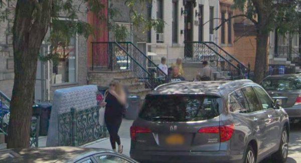 Bystanders are seen looking in the direction of the man who fell (Google Street View)