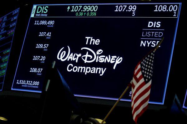A screen shows the logo and a ticker symbol for The Walt Disney Company on the floor of the New York Stock Exchange (NYSE) in N.Y., on Dec. 14, 2017. (Brendan McDermid via Reuters)