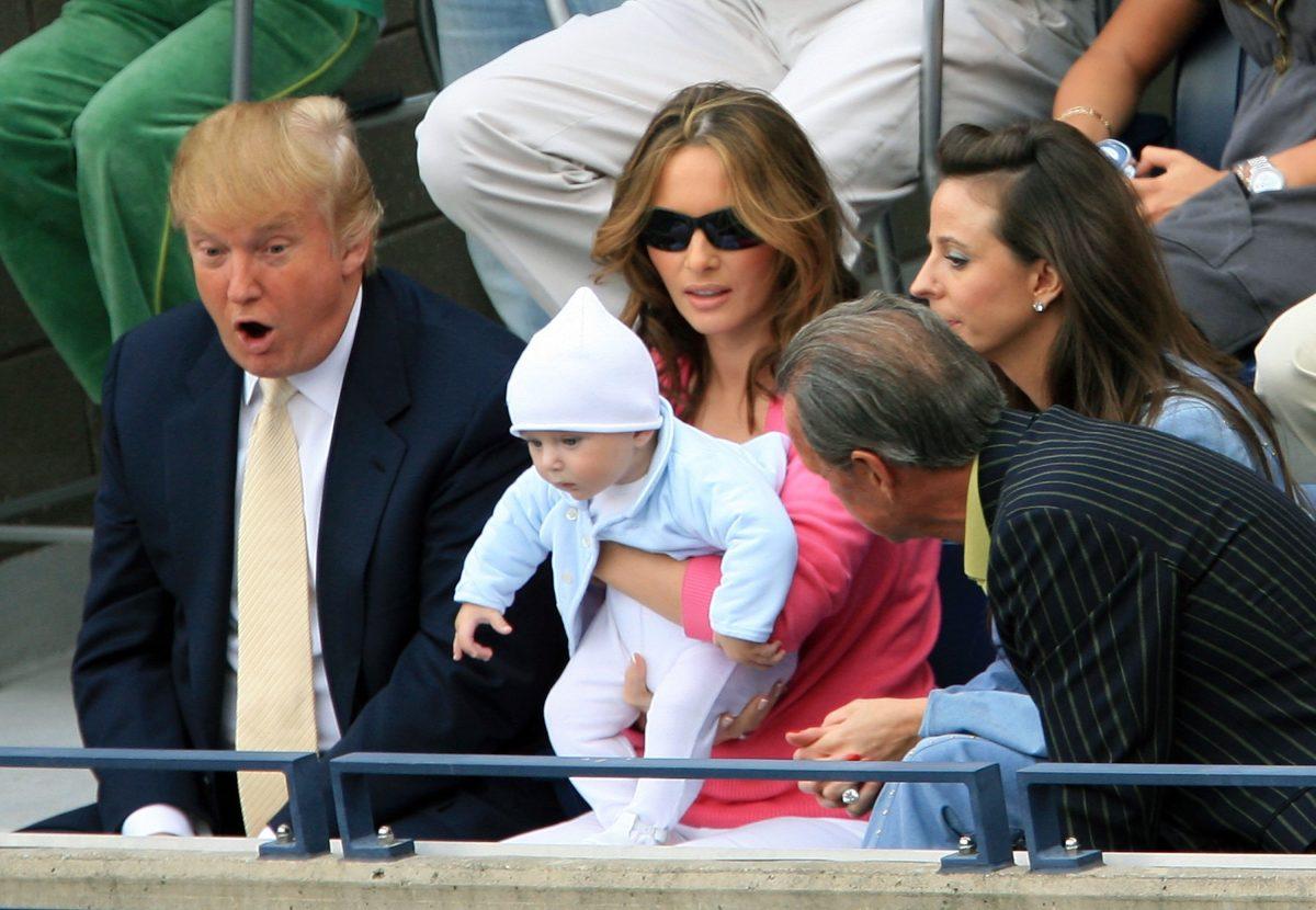 Donald Trump, baby son Barron and wife Melania Trump watch the men's final between Roger Federer of Switzerland and Andy Roddick during the U.S. Open at the USTA Billie Jean King National Tennis Center in Flushing Meadows Corona Park in the Flushing neighborhood of the Queens borough of New York City on Sept. 10, 2006. (Jamie Squire/Getty Images)