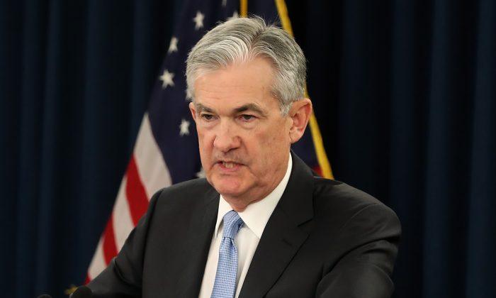 Fed Sees No Rate Hikes in 2019, Plans to Slow Balance Sheet Reduction