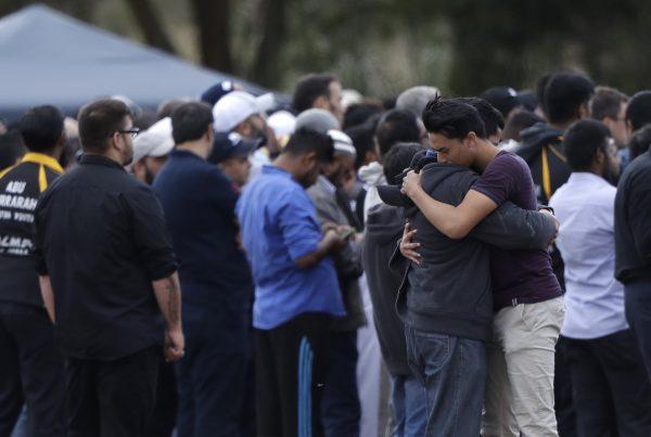Mourners react during a burial for a victim of the March 15 mosque shootings at the Memorial Park Cemetery in Christchurch, New Zealand, on March 20, 2019. (Mark Baker/AP Photo)