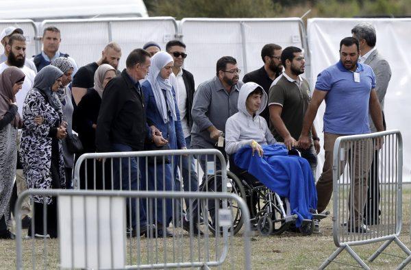 Zaed Mustafa, in a wheelchair, brother of Hamza and son of Khalid Mustafa killed in the March 15 mosque shootings arrives for the burial at the Memorial Park Cemetery in Christchurch, New Zealand, on March 20, 2019. (Mark Baker/AP Photo)