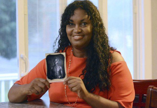 In this July 17, 2018, photo, Tamara Lanier holds an 1850 photograph of Renty, a South Carolina slave who Lanier said is her family's patriarch, at her home in Norwich, Conn. (John Shishmanian/The Norwich Bulletin via AP)